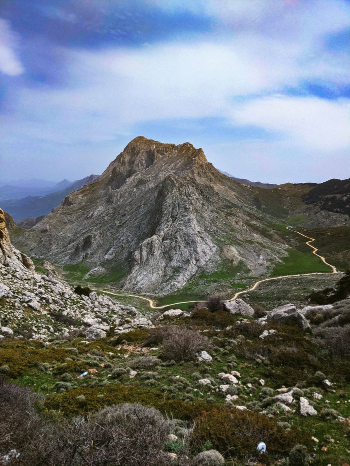 Scenic view of a majestic mountain peak in Djurdjura, Algeria, showcasing rugged terrain and open skies.